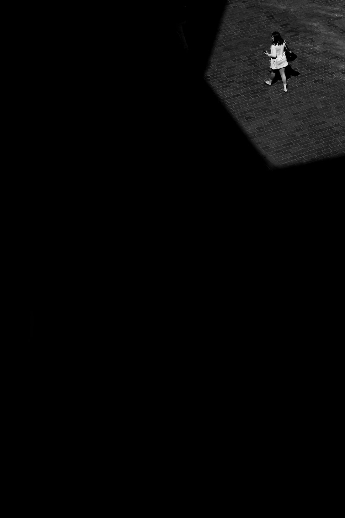 a black and white photo of a person on a baseball field