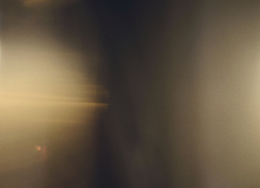 Golden light flares and abstract dark shapes